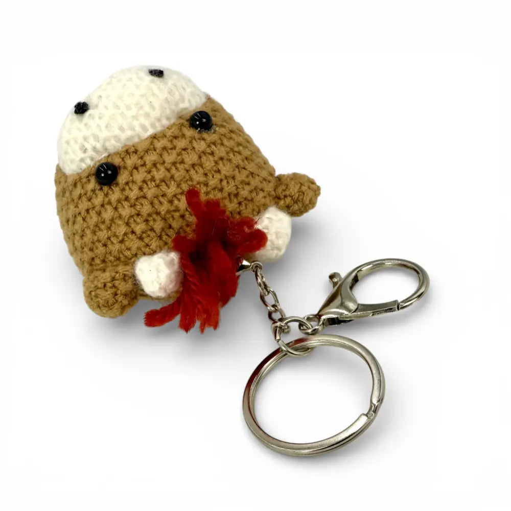 Knitted Highland Coo keychain — Alfie Scottish gift — styled product shot