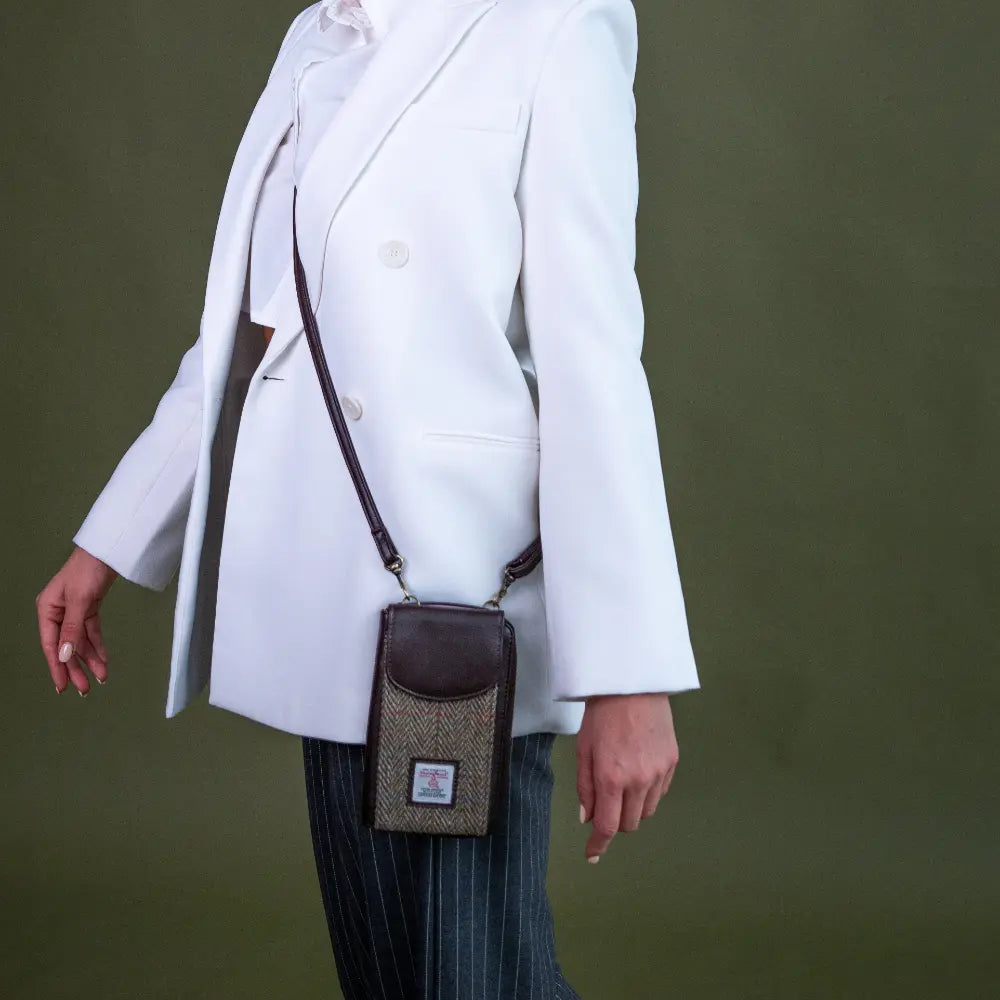 Harris Tweed phone purse — practical Scottish gift in a range of Harris Tweed colours — in use