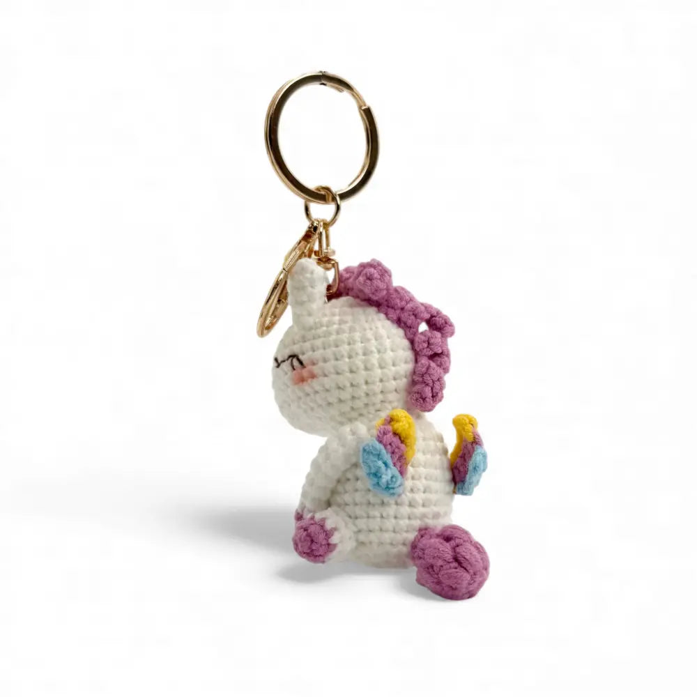 Knitted unicorn keychain — Annie the Unicorn Scottish gift — in use