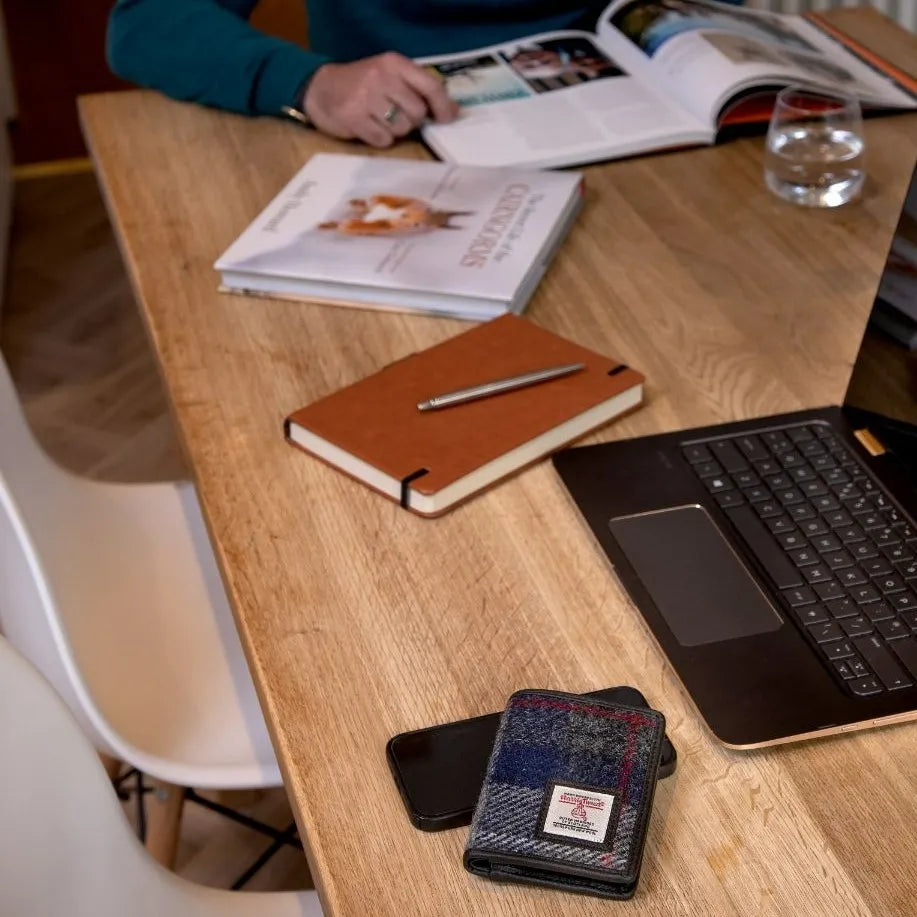 Harris Tweed slim bifold wallet — slim Scottish gift for men in a range of Harris Tweed colours — in use