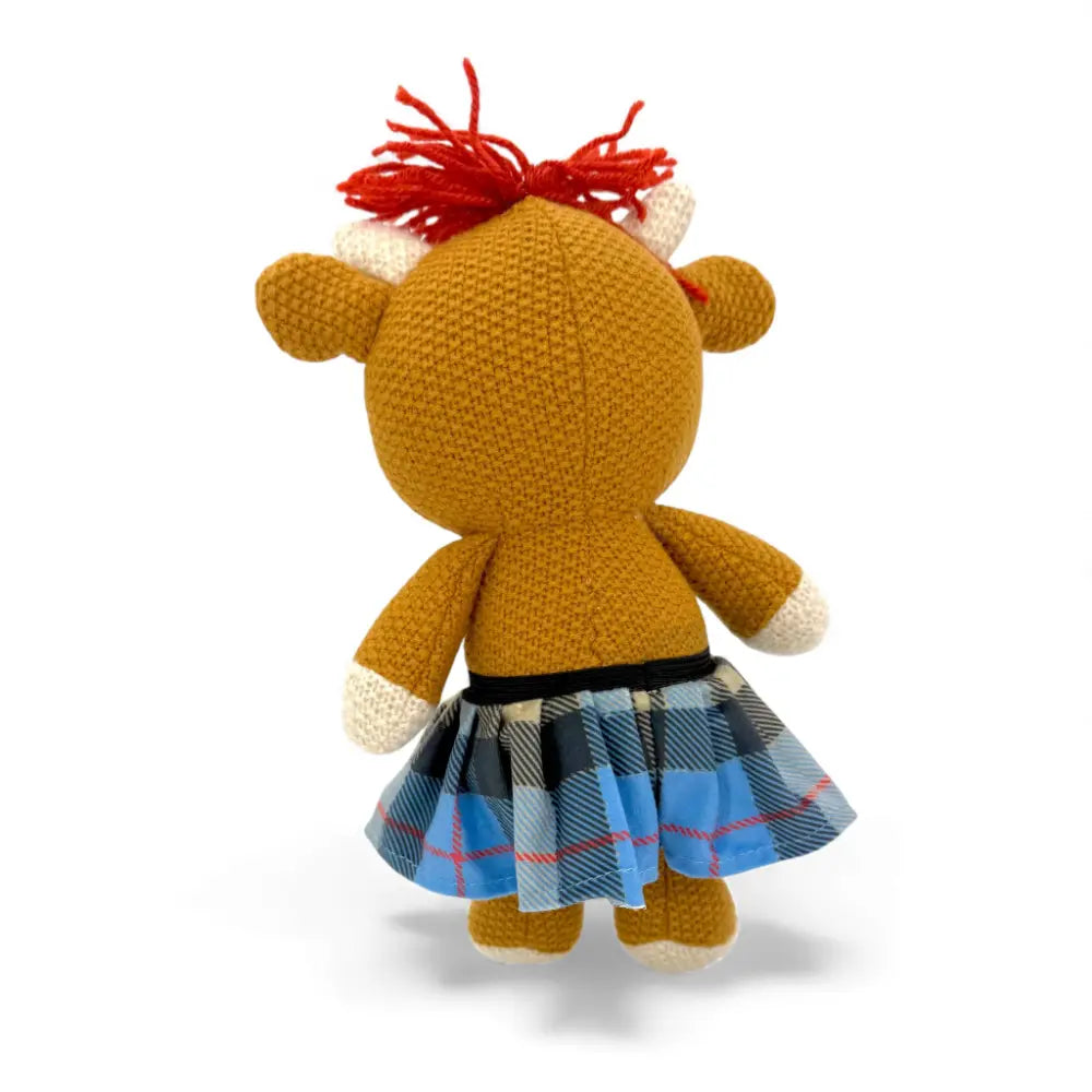 Knitted Highland Coo soft toy — Alfie the Highland Coo — in use