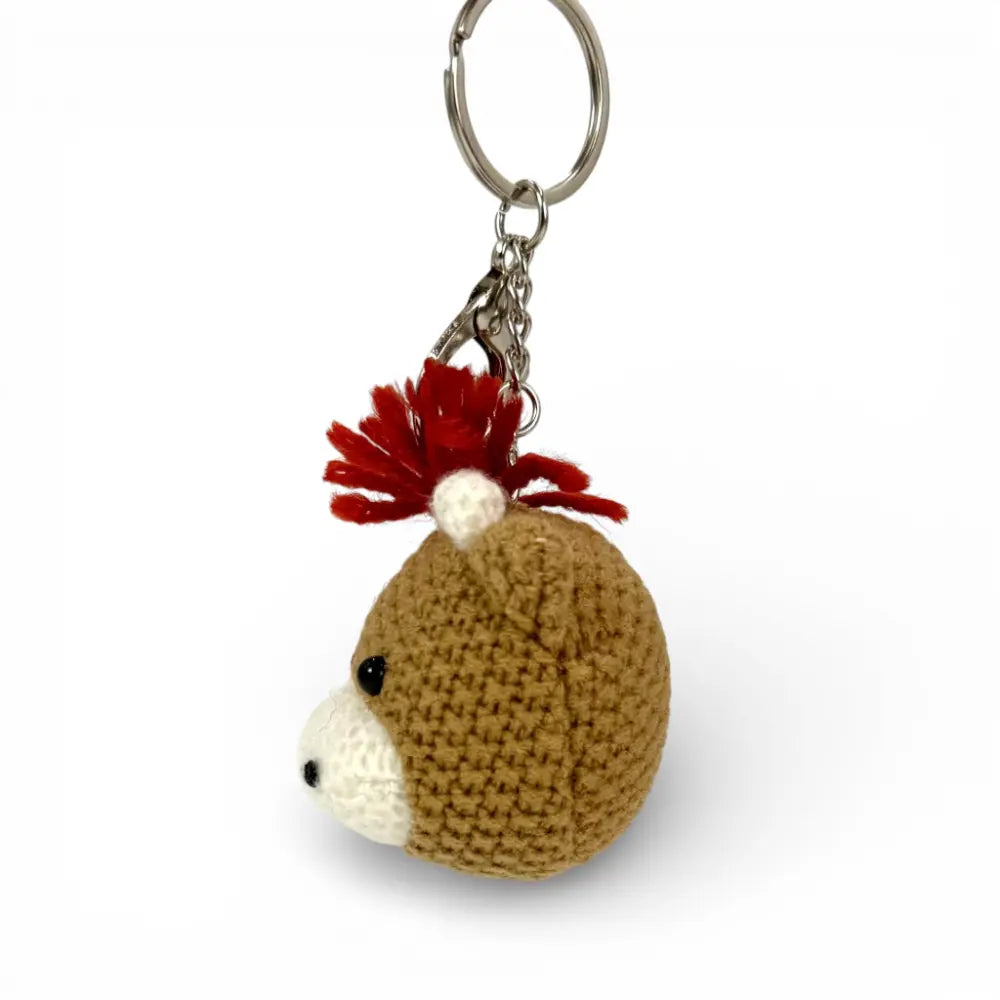 Knitted Highland Coo keychain — Alfie Scottish gift — in use